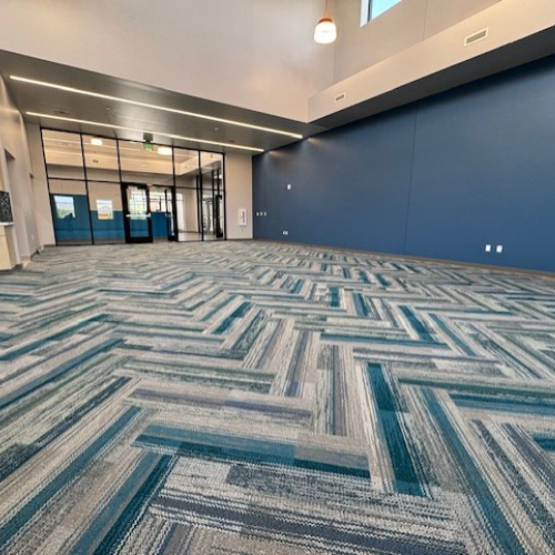Zig zag blue and gray carpet in a community center